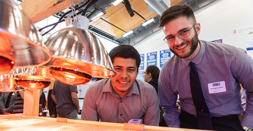 Students show off one of their projects for Innovate the Grow audiences.